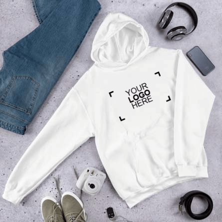 Custom hoodie with logo design surrounded by cell phone, headphones, camera, and jeans